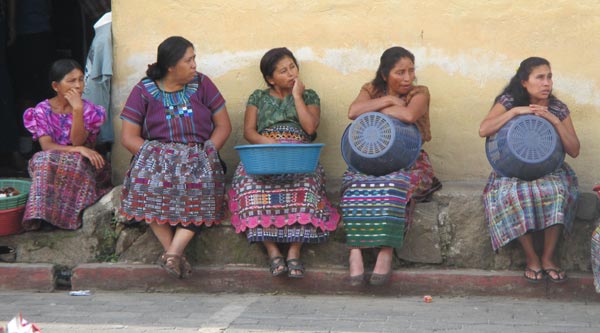 Photos of women in line for food assistance