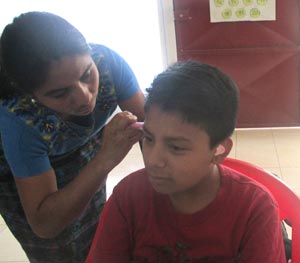 photo of a woman fitting hearing aids