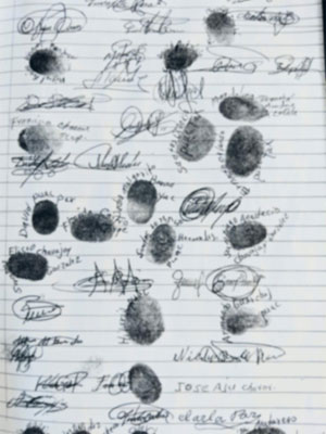 Photo showing thumbprints and signatures collected in support of the land purchase